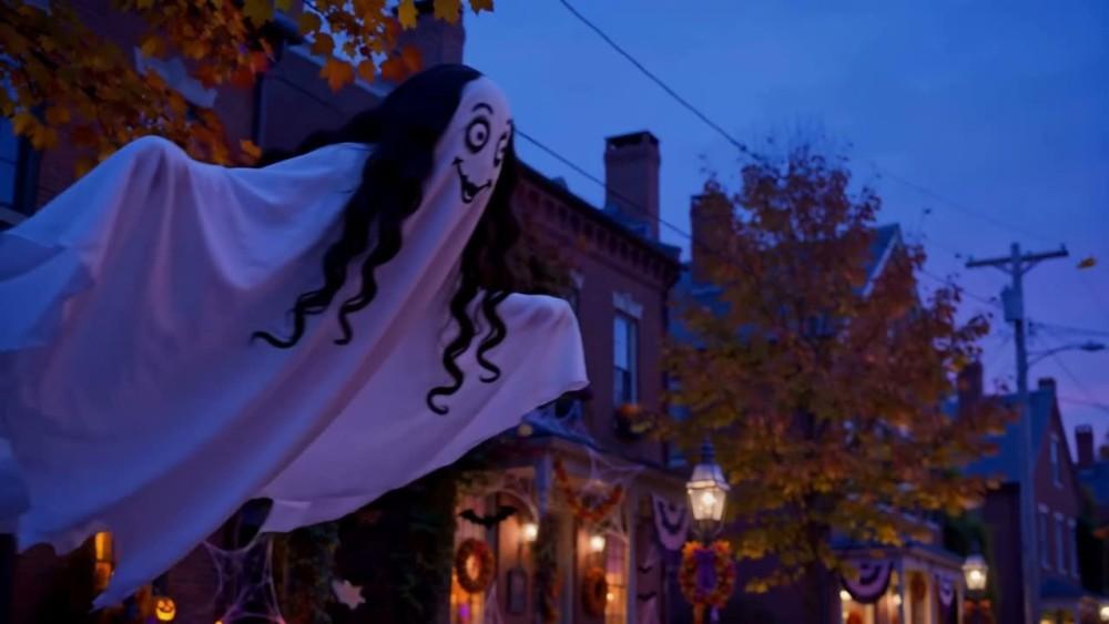 Sheet ghost flying over a dusk street in Coolidge Corner