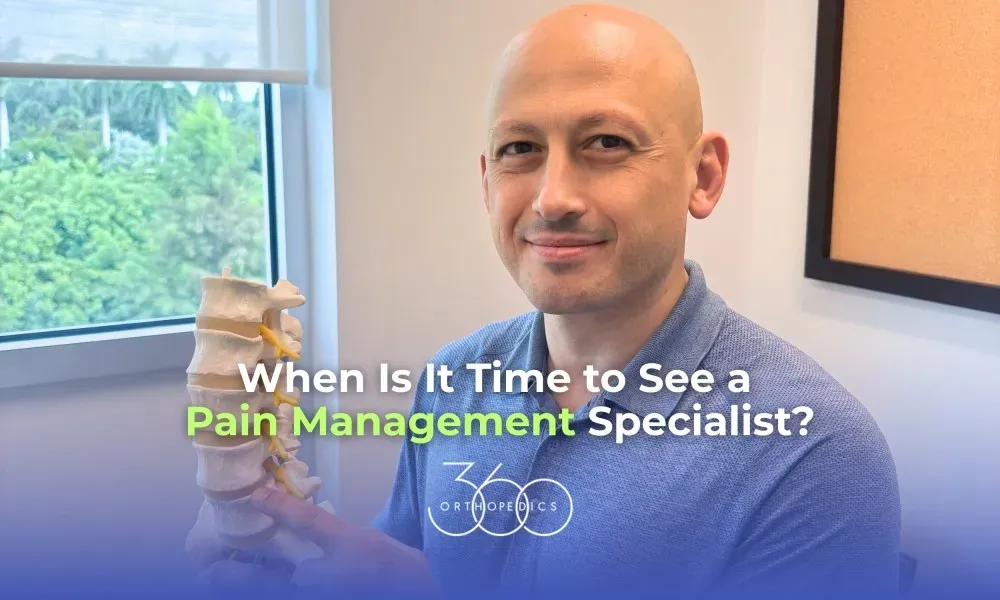 Dr. Ashot Kotcharian holding a spine model at 360 Orthopedics