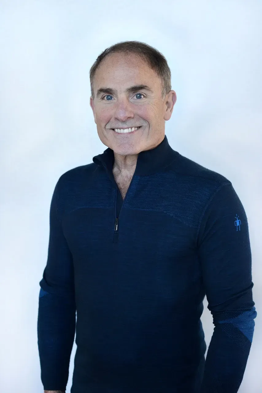 Robert H. Price, MD, wearing a dark blue jacket against a light background.