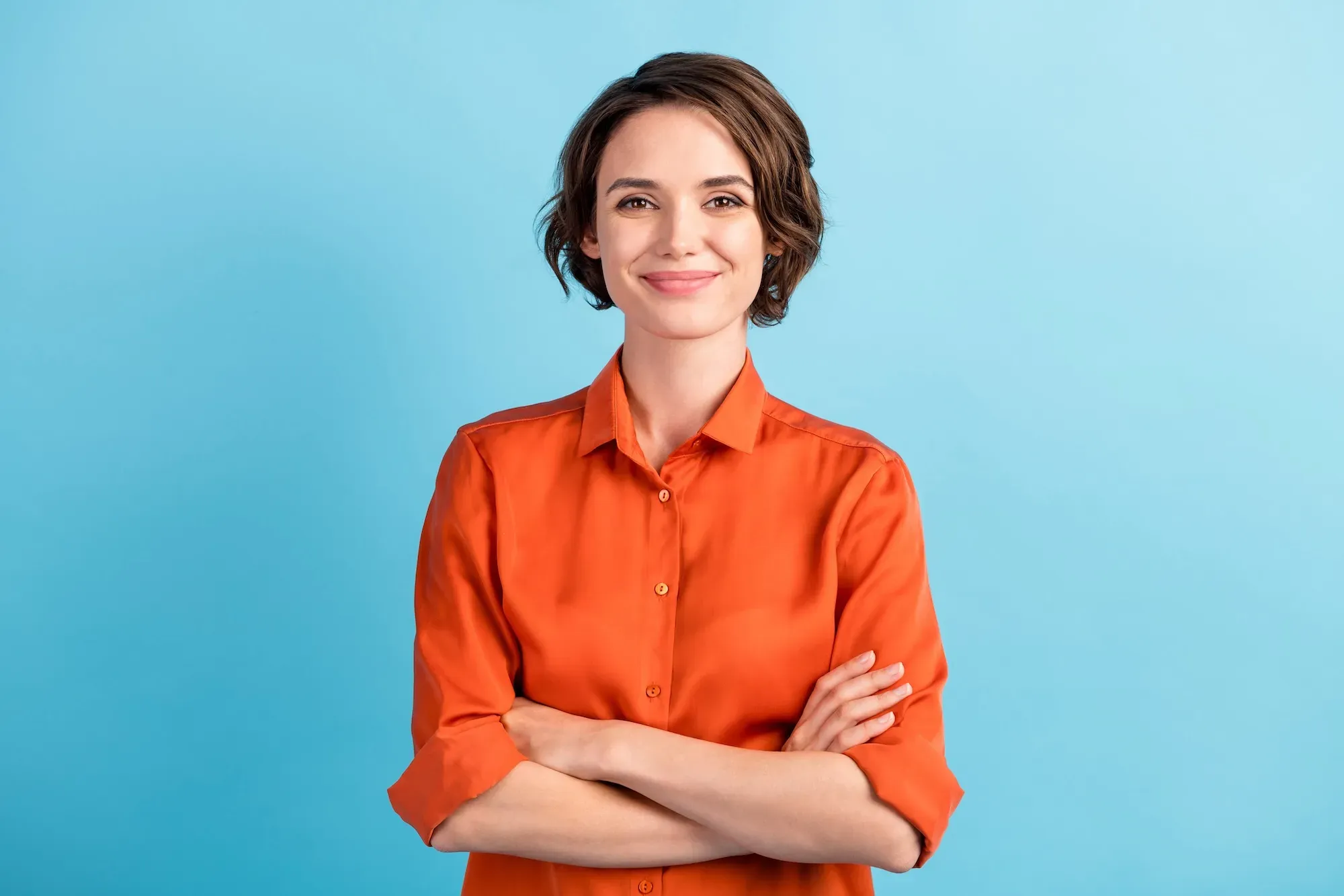 happy woman in an orange sweater