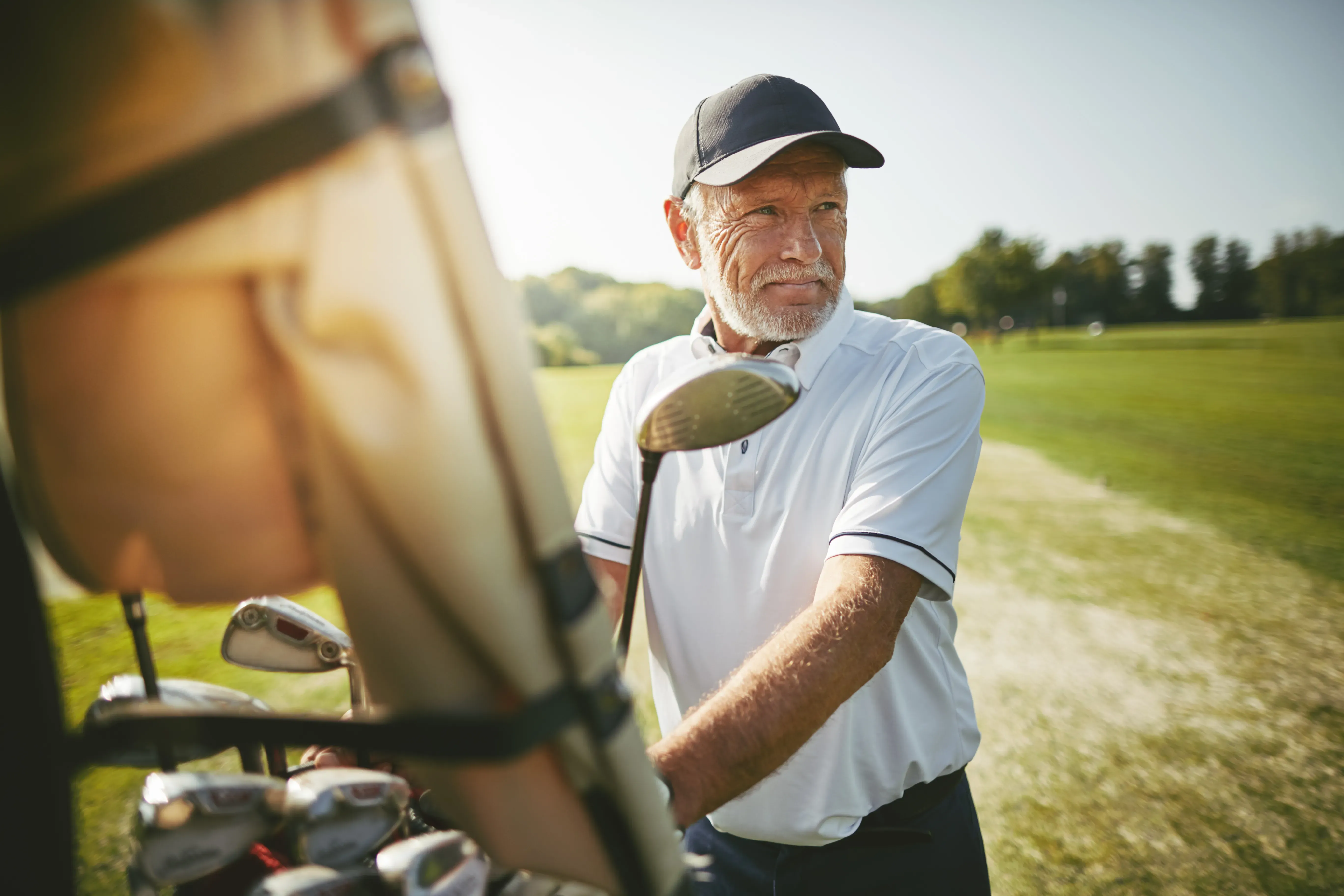 senior man playing golf