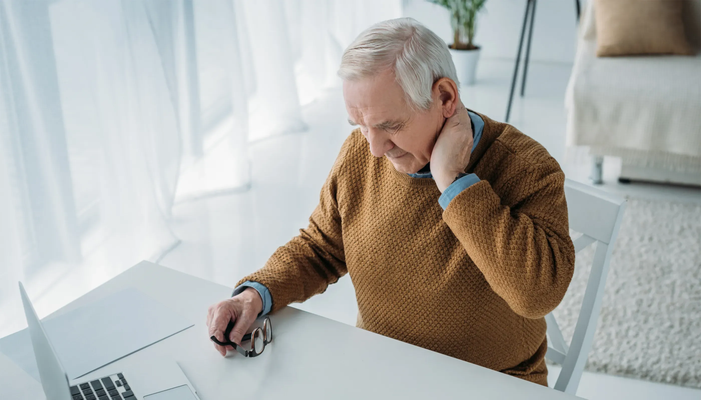 senior man with neck pain